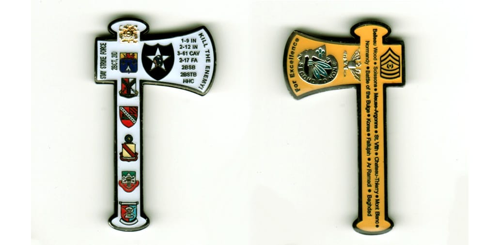 Hatchet shaped,  brass colored coin, 1 7/8 inches high x 1 1/4 inches wide.