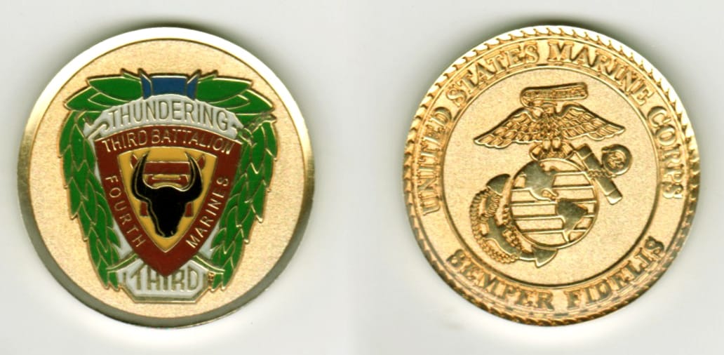 Round shaped, gold colored coin, 1 1/2  inches in diameter.