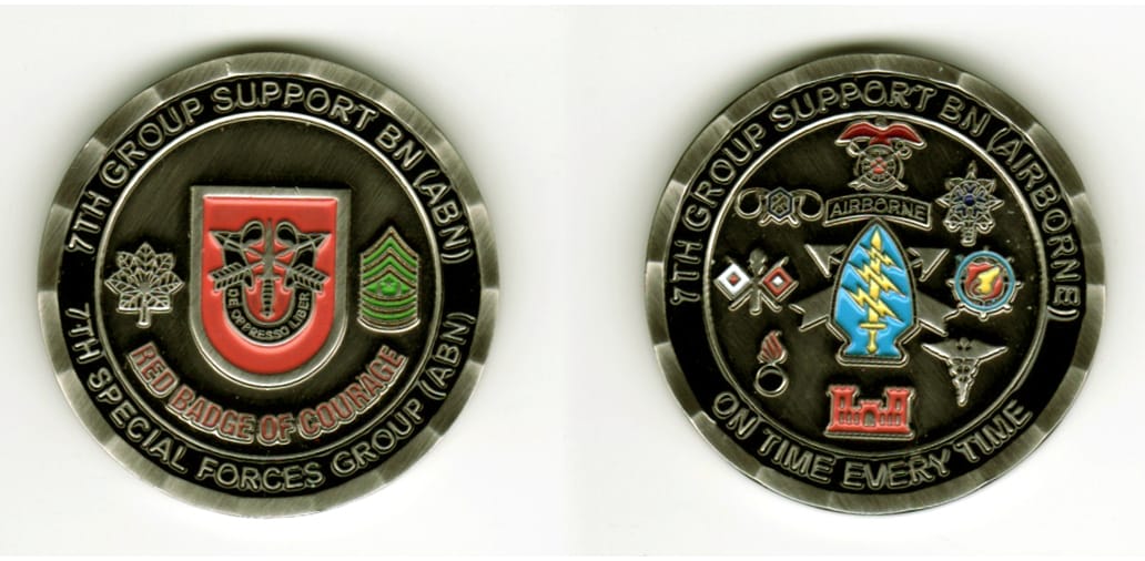 Round shaped, blackened silver colored coin, 1 11/16  inches in diameter.