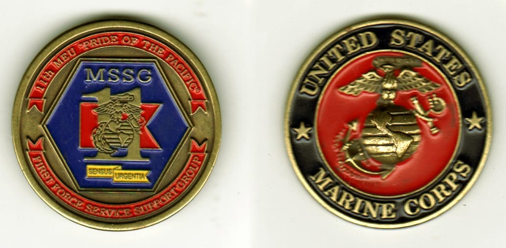 Round shaped, antique brass colored coin, 1 1/2  inches in diameter.