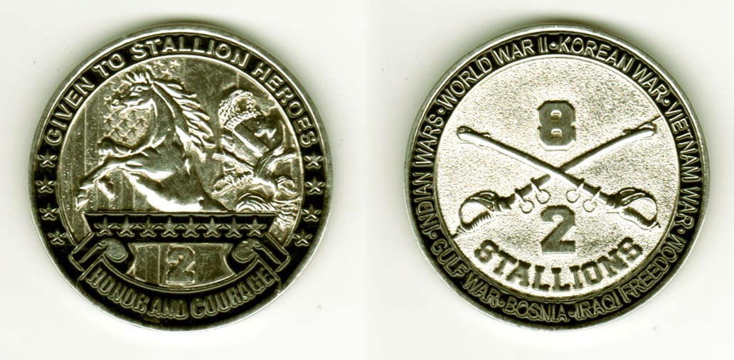 Round shaped, silver colored coin, 2  inches in diameter.