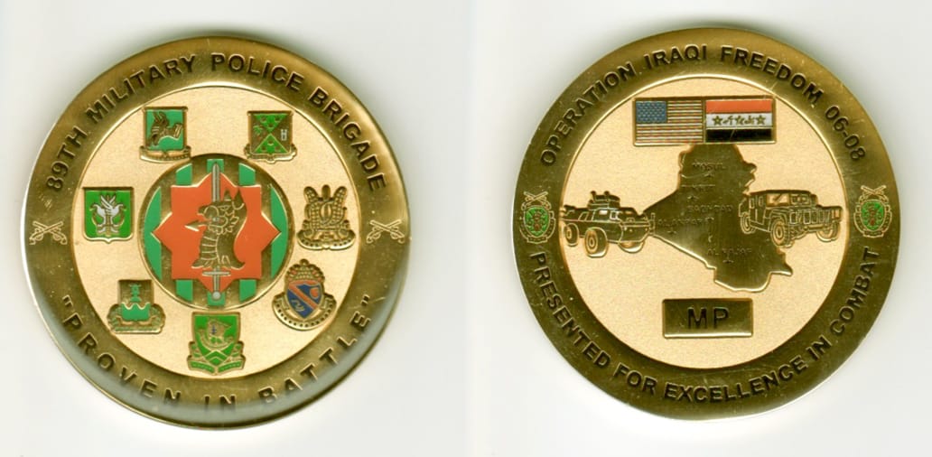 Round shaped, gold colored coin, 2  inches in diameter.