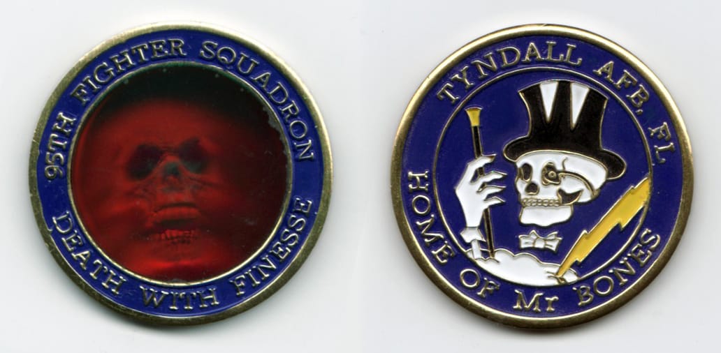 Round shaped, gold colored coin with holographic center  1½ inches in diameter.