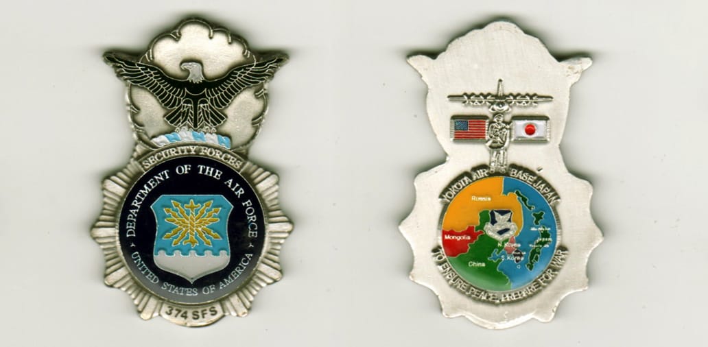 Badge shaped with circle mounted above with eagles outstreatched wings extending, pewter colored coin, 2 inches high x 1...