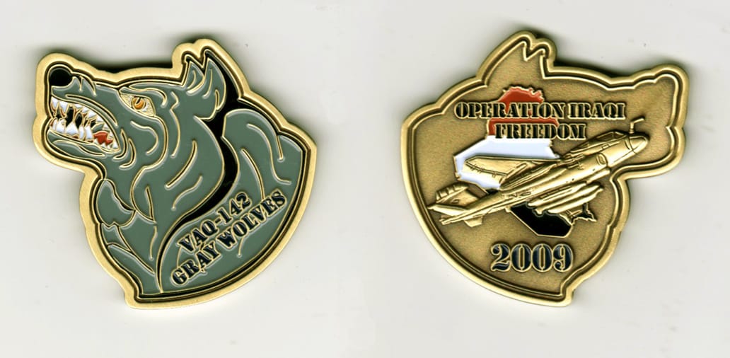 Wolf head shaped, gold colored coin, 2 inches high x 2 1/2 inches wide