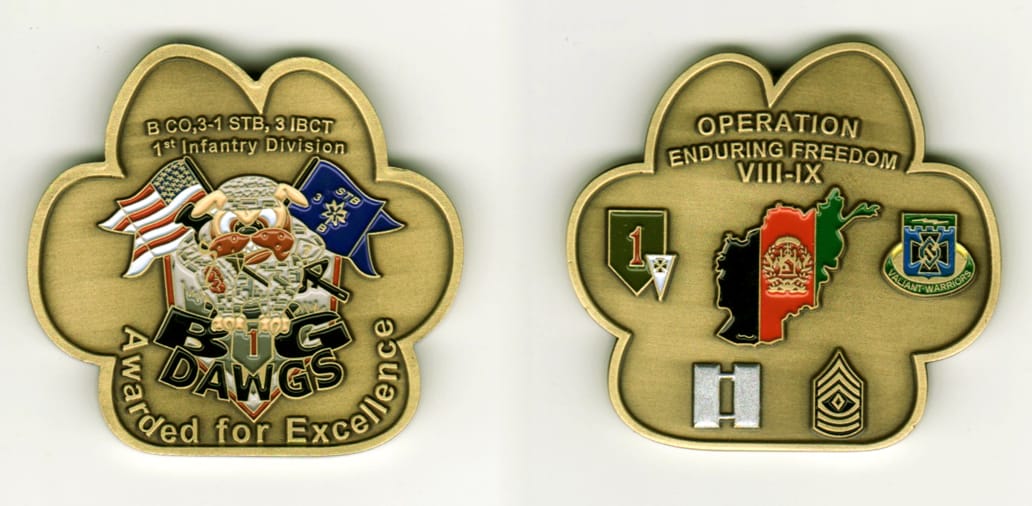 Paw shaped, brass colored coin, 1 7/8 inches high x 2 inches wide