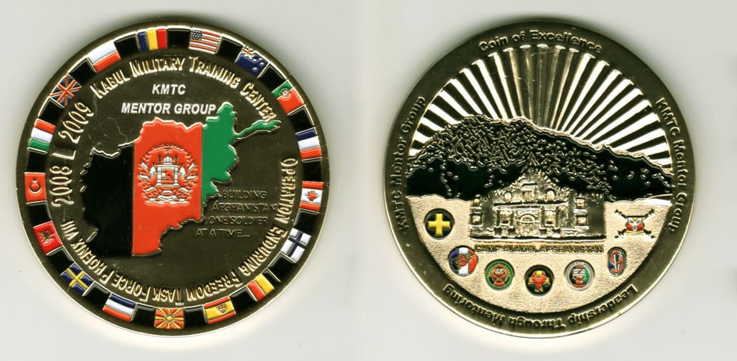 Round shaped, gold colored coin, 2  9/16 inches in diameter.