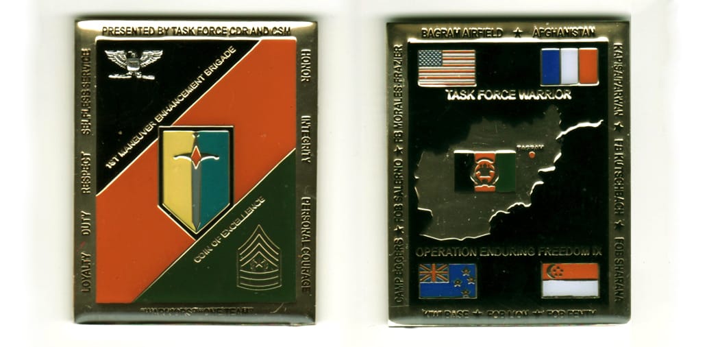 Retangular shaped , brass colored coin, 2  1/2 inches high x 2 inches wide