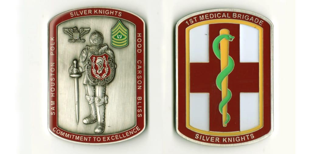 Retangular shaped with bowed ends, pewter colored coin, 2  1/2 inches high x 1 3/4 inches wide