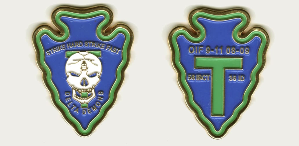 Arrowhead  shaped, gold colored coin, 2 inches high x 1 1/2  inches wide