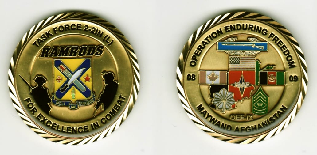 Round shaped, brass colored coin, 2 1/8 inches in diameter.