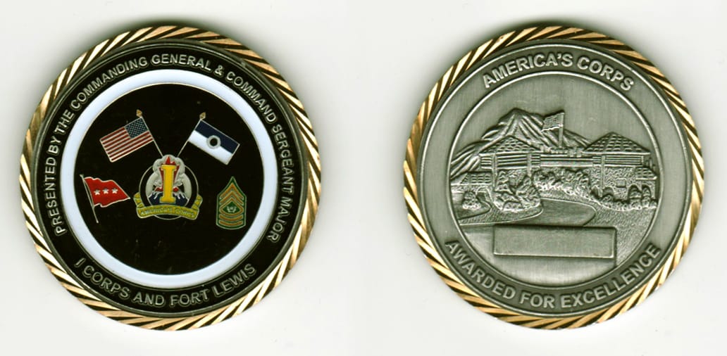 Round shaped, silver colored coin with gold colored edge, 2 1/8 inches in diameter.