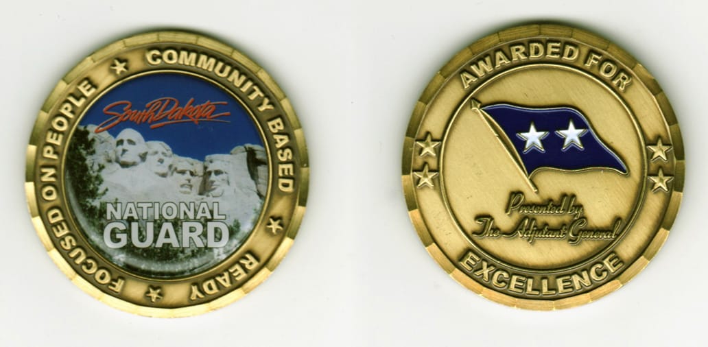 Round shaped, brass colored coin, 2  inches in diameter.