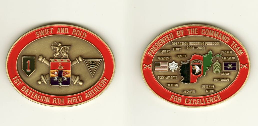 Oval shaped, brass colored coin, 1 1/2 inches high x 2 1/2 inches in diameter.