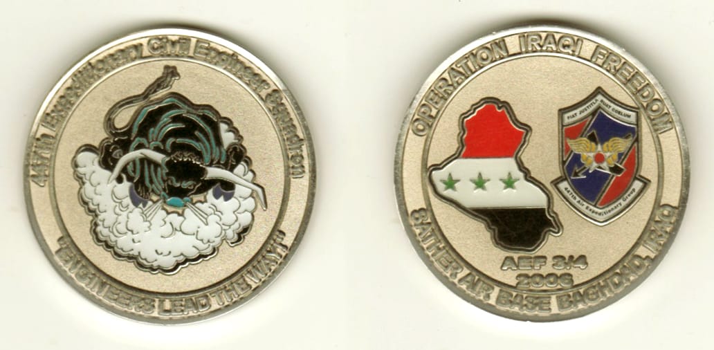 Round shaped, silver colored coin, 1 11/16 inches in diameter.