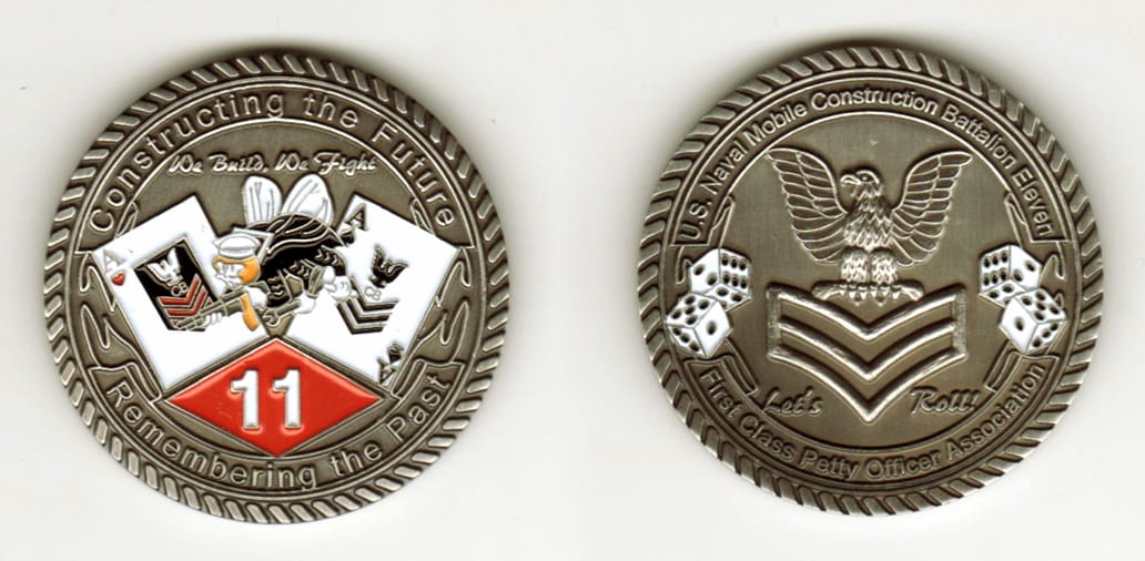 Round shaped, pewter colored coin, 1 11/16 inches in diameter.