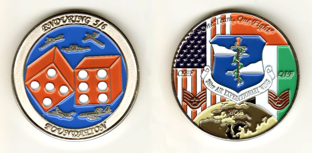 Round shaped, silver colored coin, 1 11/16 inches in diameter.