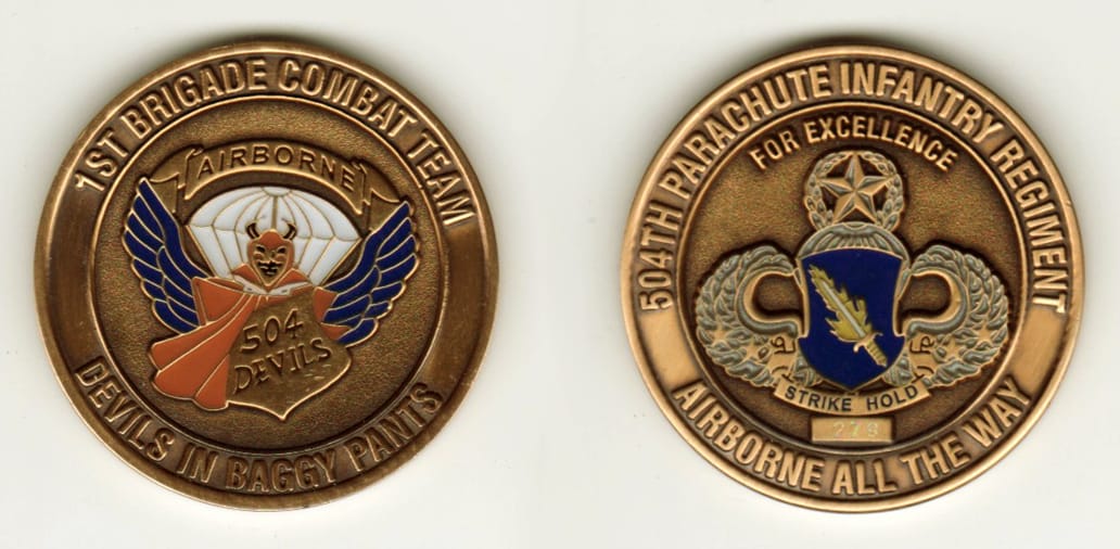 Round shaped, brass colored coin, 1 9/16 inches in diameter.