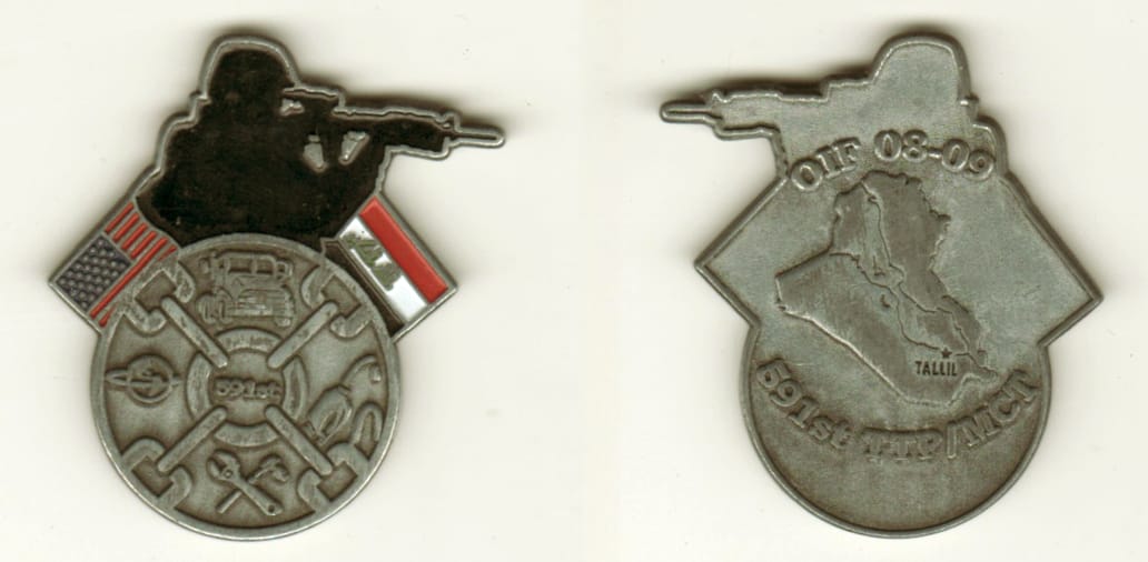 Round shaped with Marksman flanked by two flags mounted above, pewter colored coin, 1 3/4 inches high x 1 1/2 inches wid...