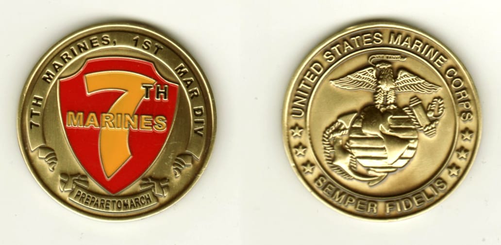 Round shaped, brass colored coin, 1 1/2 inches in diameter.