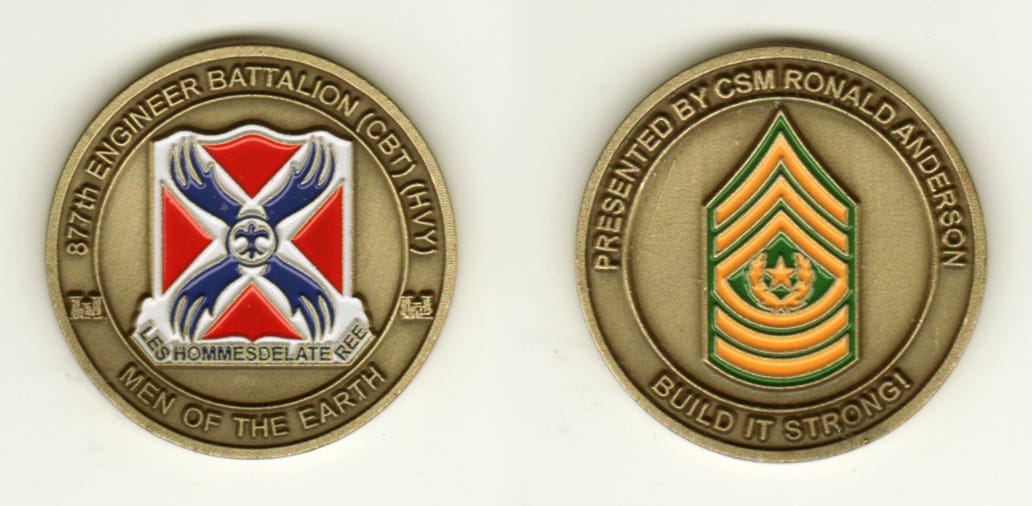 Round shaped, brass colored coin, 1 1/2 inches in diameter.