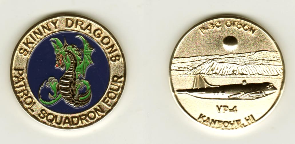 Round shaped, gold colored coin, 1 1/2 inches in diameter.