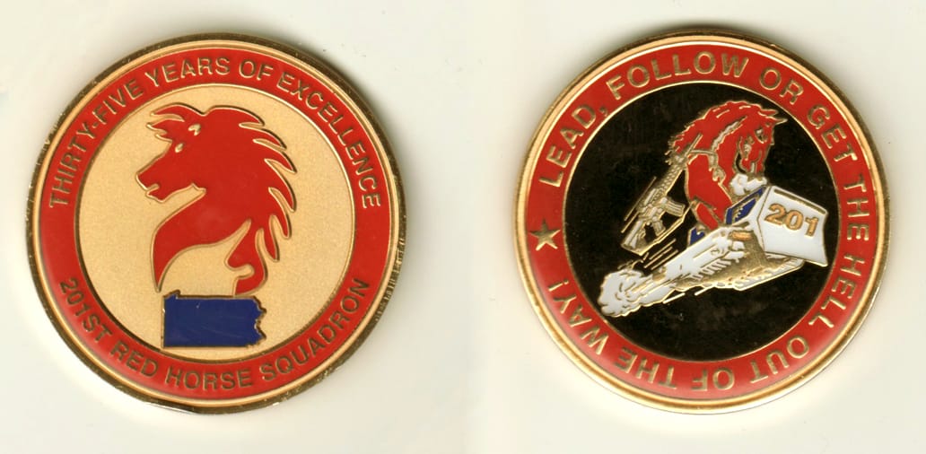 Round shaped, gold colored coin, 2 inches in diameter.