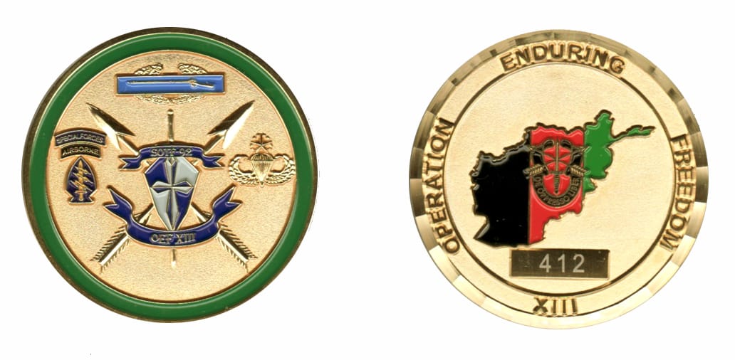 Round shaped, gold colored coin, 2 inches in diameter.