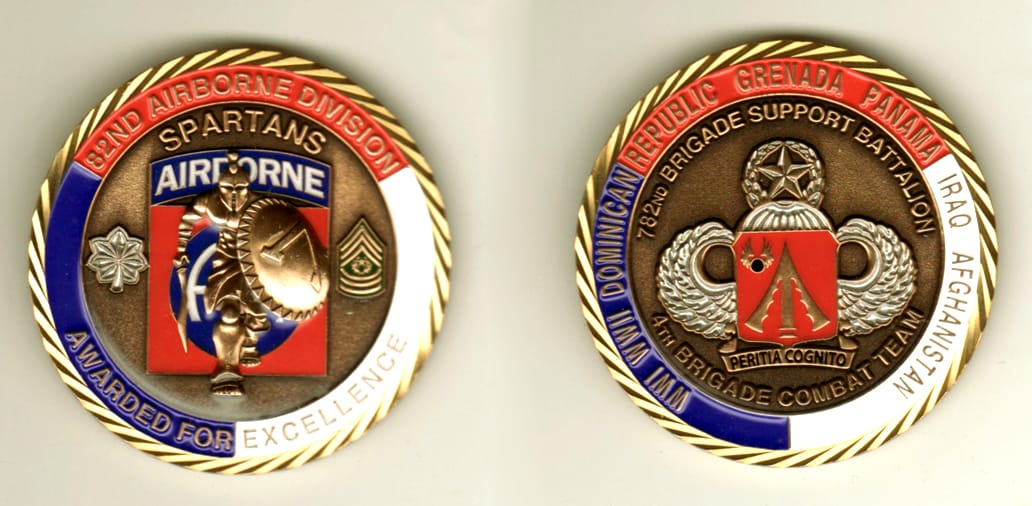 Round shaped, brass colored coin, 2 1/8 inches in diameter.