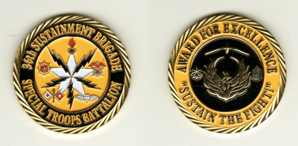 Round shaped, brass colored coin, 1 11/16 inches in diameter.