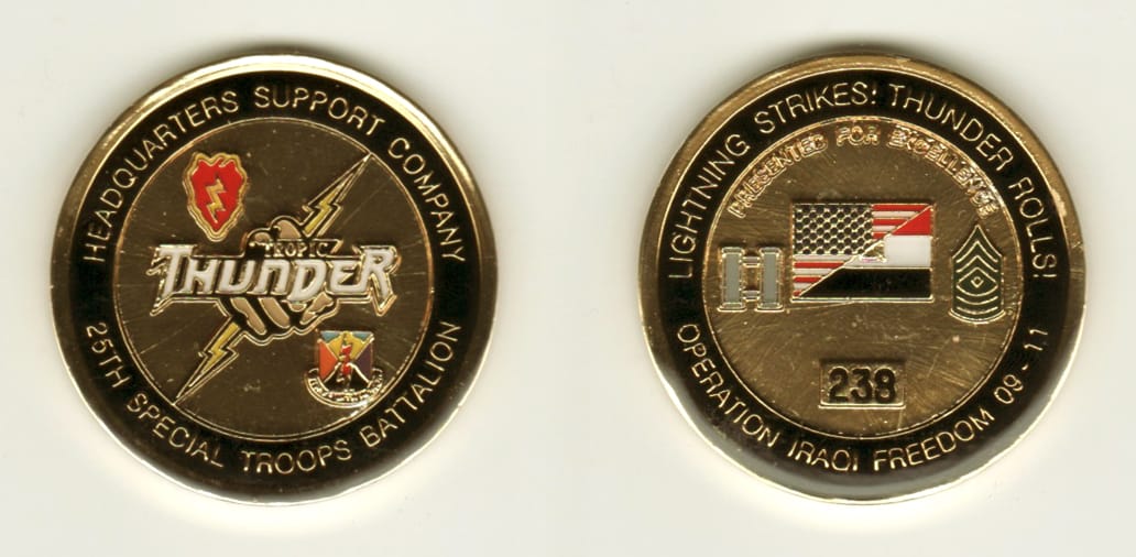 Round shaped, gold colored coin, 1 11/16 inches in diameter.