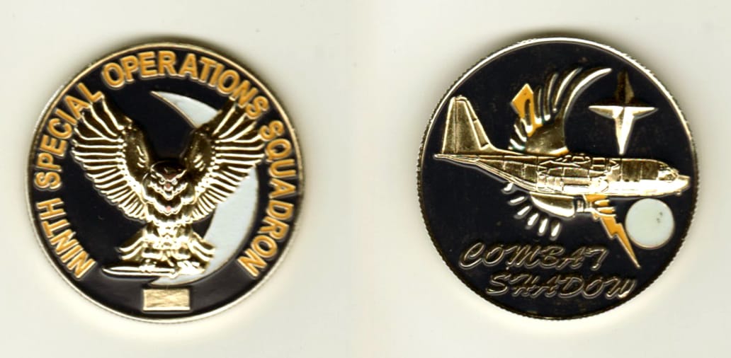 Round shaped, gold colored coin, 1 1/4 inches in diameter.