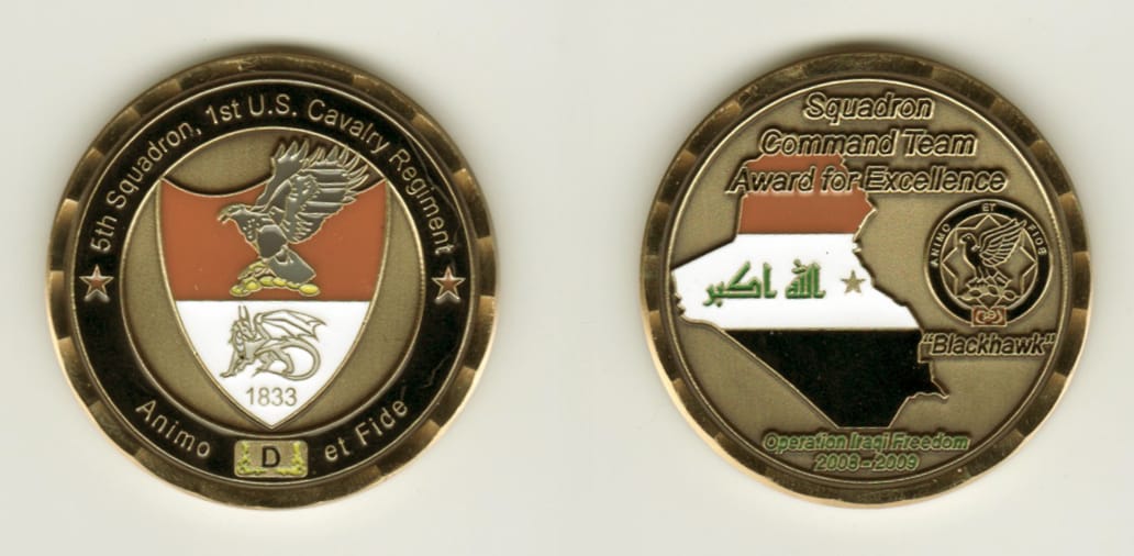 Round shaped, brass colored coin, 1 11/16 inches in diameter.