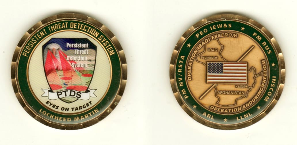 Round shaped, brass colored coin, 1 11/16 inches in diameter.