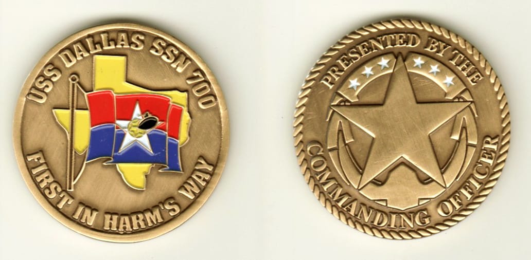 Round shaped, brass colored coin, 1 1/2 inches in diameter.