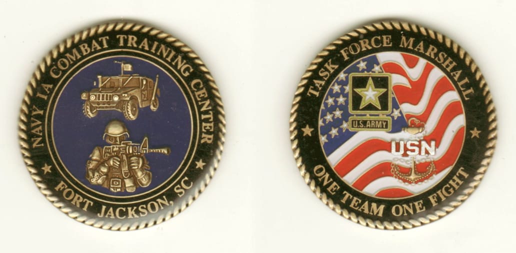 Round shaped, brass colored coin, 1 11/16 inches in diameter.