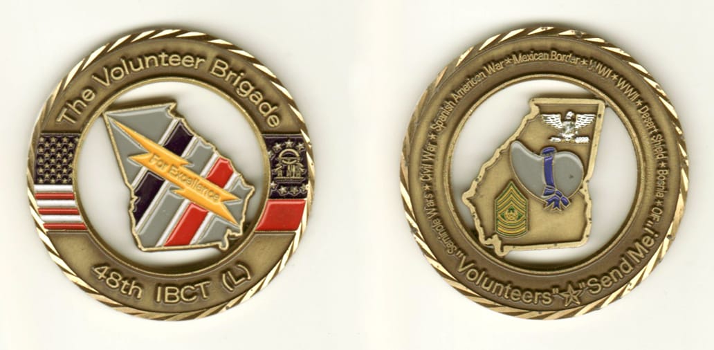 Round shaped, brass colored coin, 2 inches in diameter.