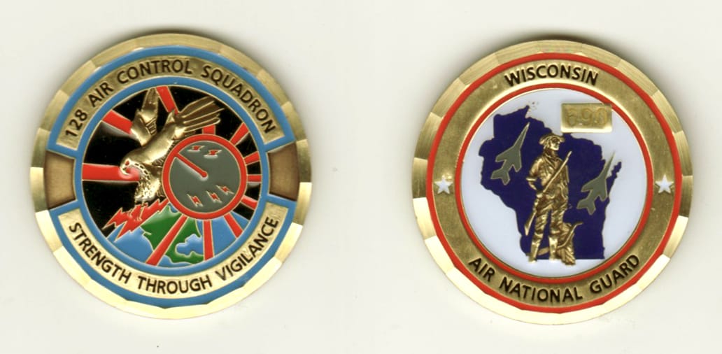 Round shaped, brass colored coin, 1 1/2 inches in diameter.