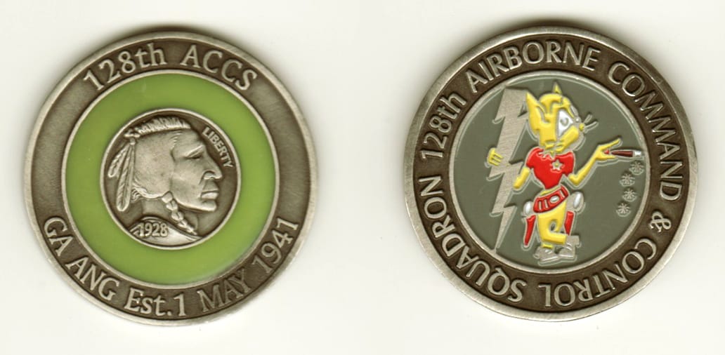 Round shaped, pewter colored coin, 1-5/8 inches in diameter.