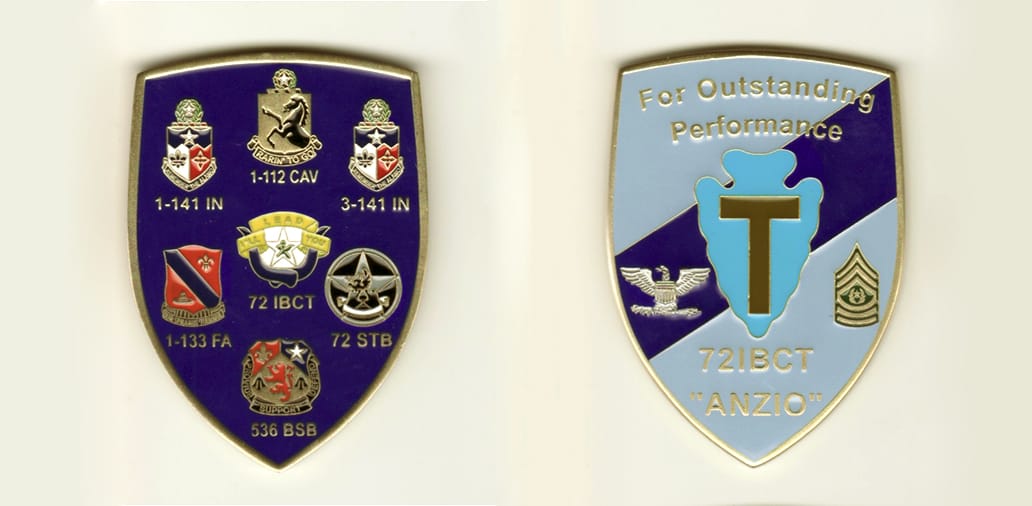 Shield shaped, brass colored coin, 2 1/2  inches high x 1 1/2 inches wide.