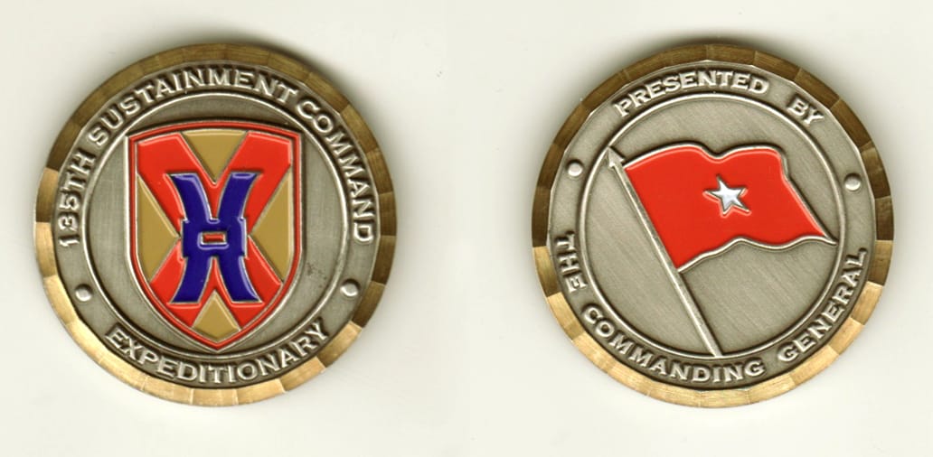 Round shaped, pewter colored coin, 1 11/16 inches in diameter.