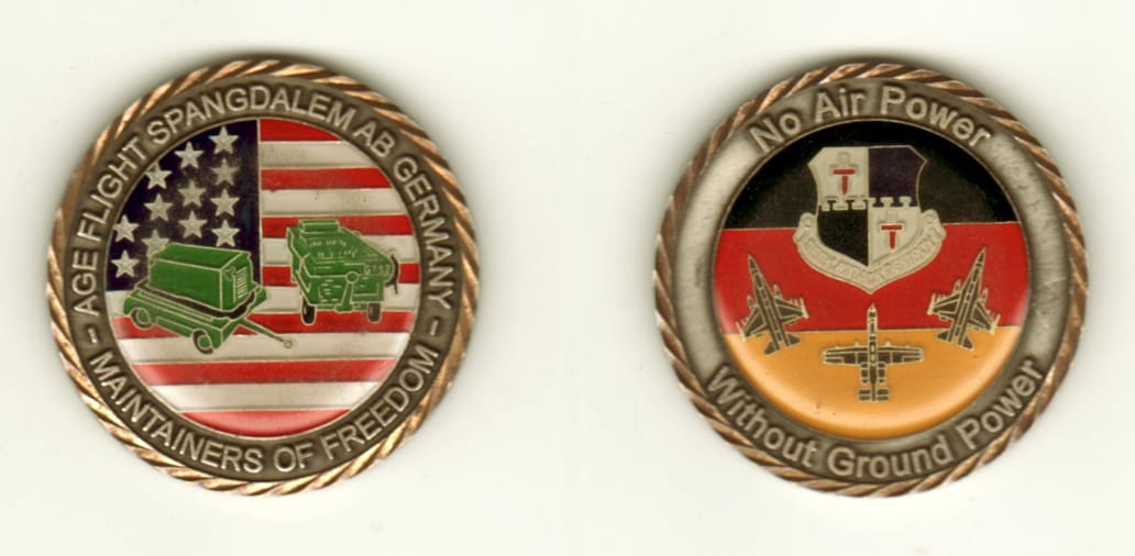 Round shaped, brass colored coin, 1 13/16 inches in diameter.