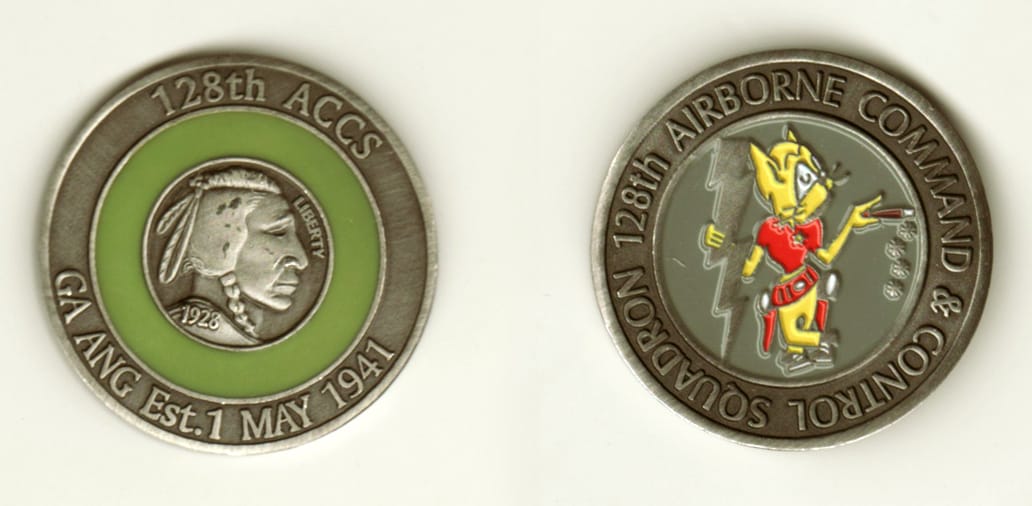 Round shaped, pewter colored coin, 1-5/8 inches in diameter.