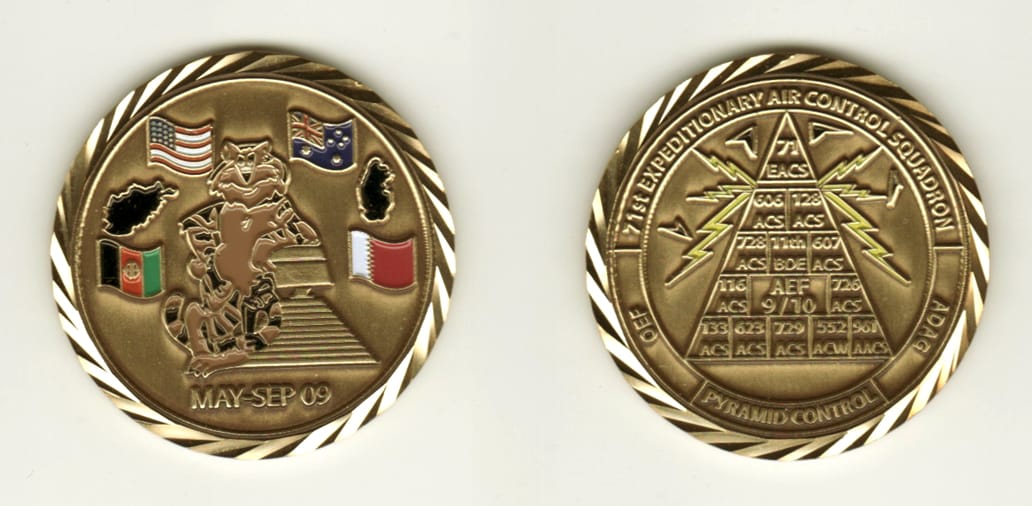 Round shaped, brass colored coin, 1 13/16 inches in diameter.