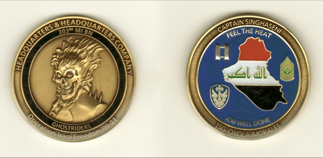 Round shaped, brass colored coin, 1 13/16 inches in diameter.