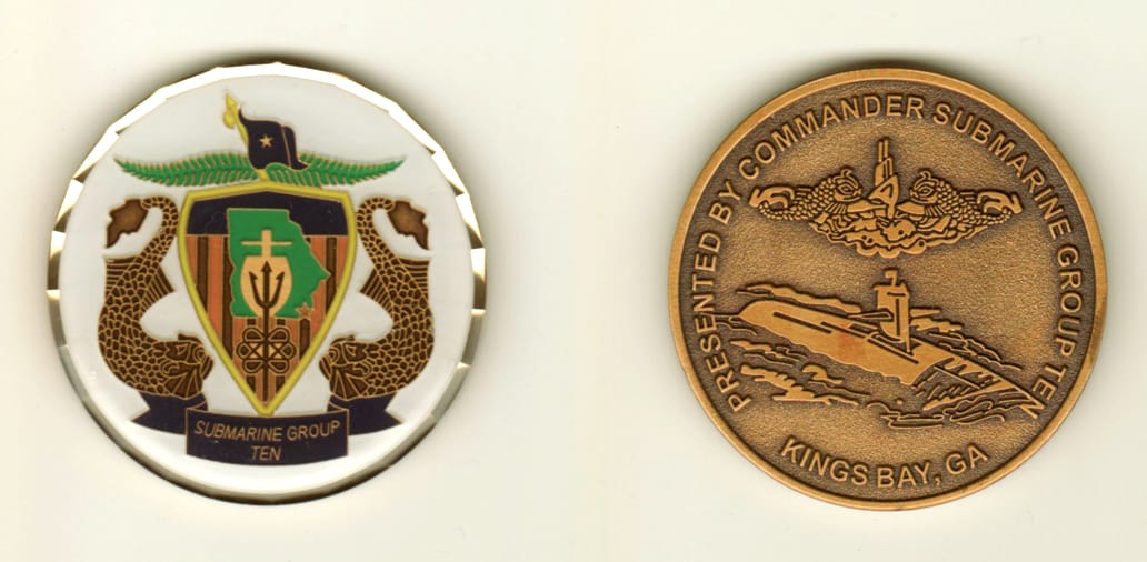 Round shaped, brass colored coin, 1 11/16 inches in diameter.