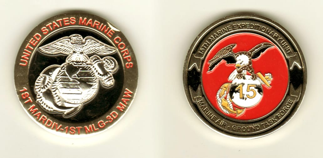 Round shaped, gold colored coin, 1 13/16 inches in diameter.