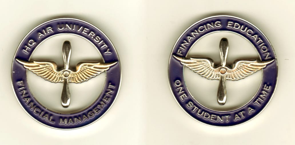 Round shaped, silver colored coin, 1 13/16 inches in diameter.