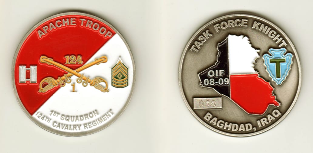 Round shaped, pewter colored coin, 2 inches in diameter.