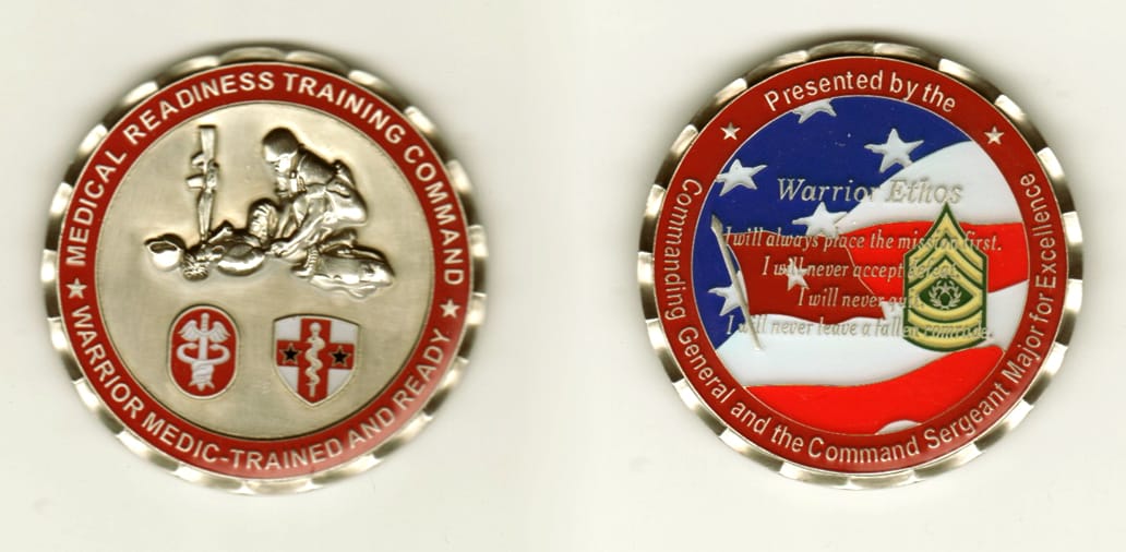 Round shaped, pewter colored coin, 2 inches in diameter.